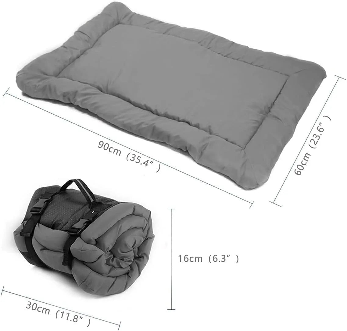 Blue foldable waterproof dog bed shown both open and folded with nylon buckles, on grass.