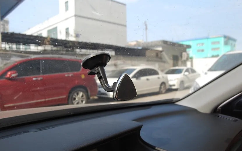 Black magnetic car phone holder with 360-degree rotation for dashboard and windshield mounting