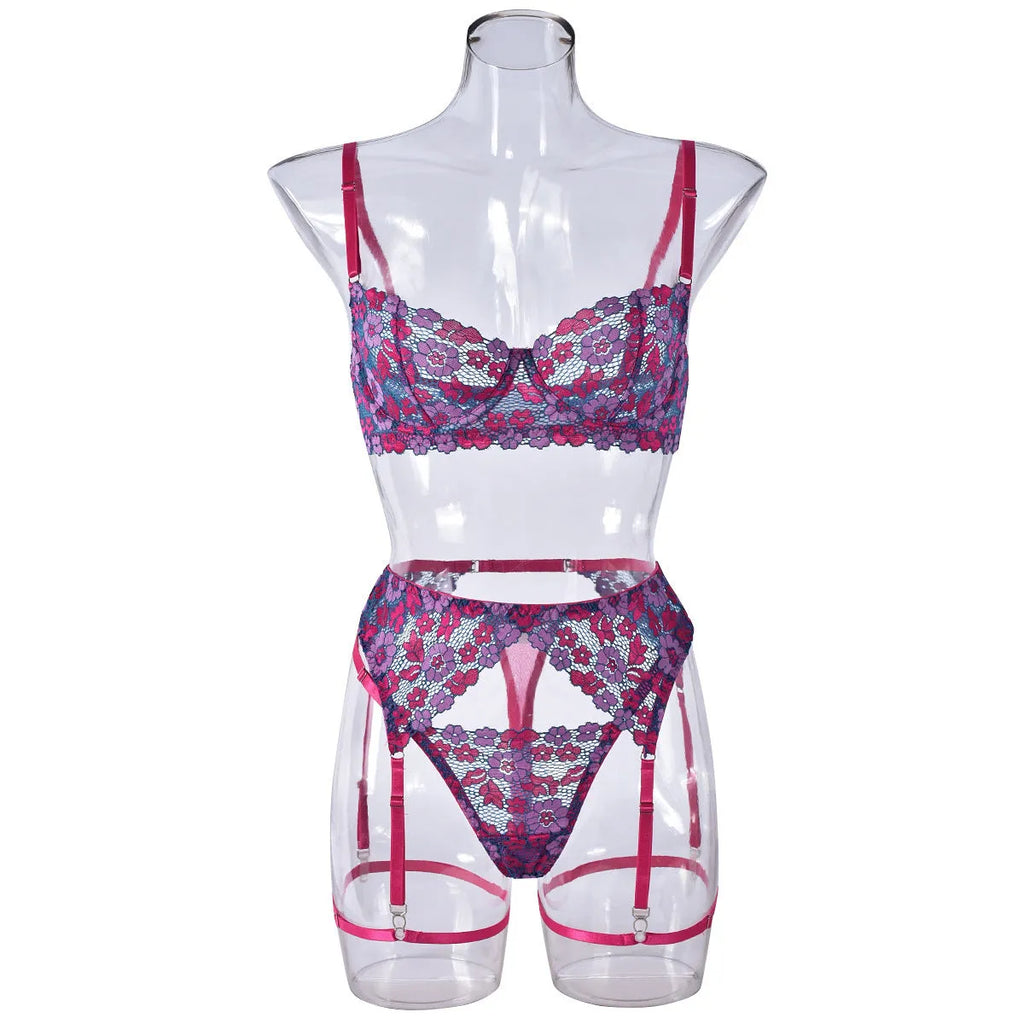 Rose red women's two-piece bikini with embroidered contrast detail on a mannequin.