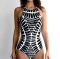 Backless one-piece swimsuit with printed striped pattern, shown in a women's swimming costume style, sizes S to XXL.