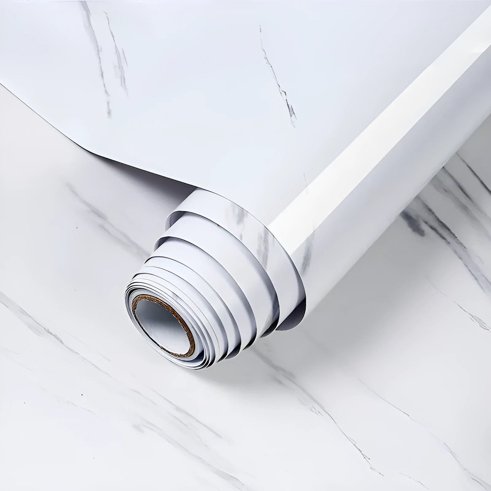 Roll of white and grey marble pattern waterproof PVC sticker for kitchen walls, showing its 2 metre length.