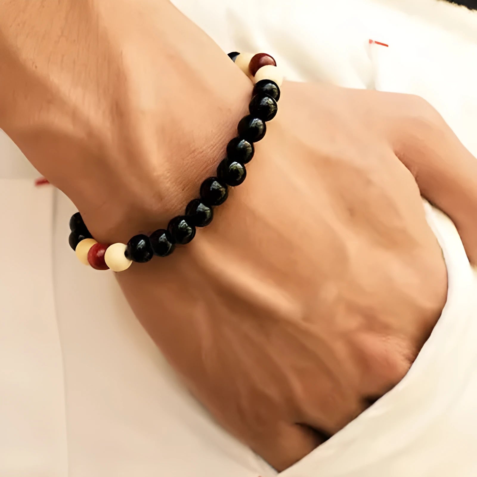 Natural stone essential oil bracelet with lava stone beads on wrist, showing ethnic style unisex design