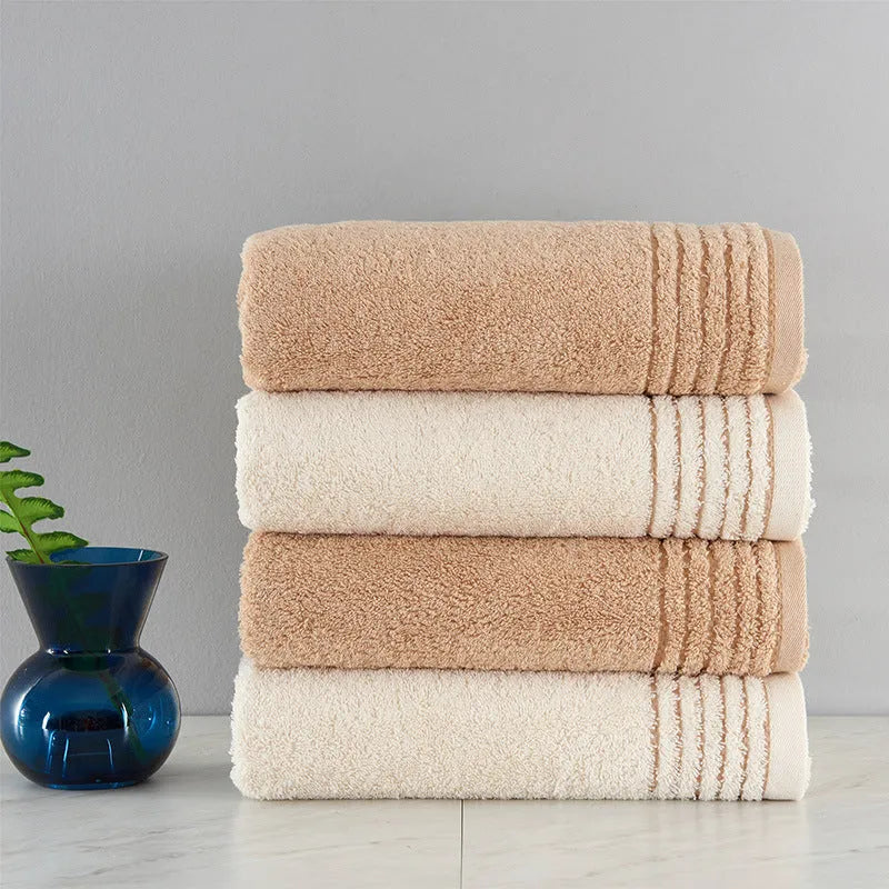 Cotton towels set showing bath, hand and guest towels in brown colour