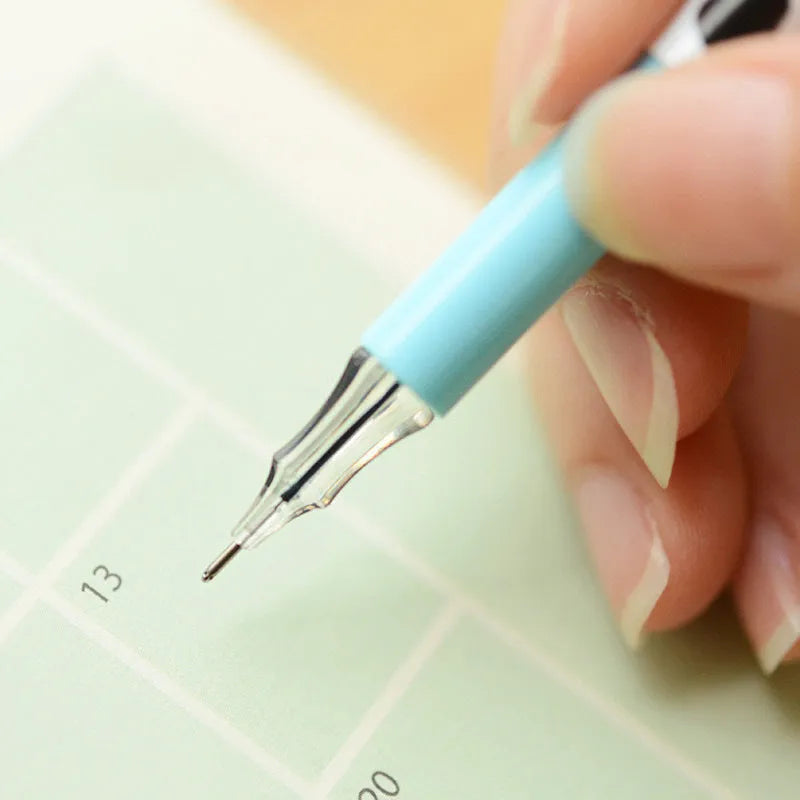 Box of 12 cow print coloured gel pens with 0.38mm fine tips on a desk.