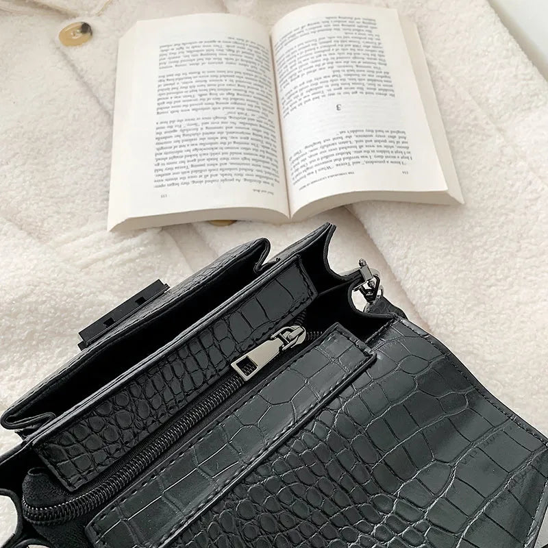 A PU fabric crossbody bag with an adjustable strap, shown in dark brown colour.