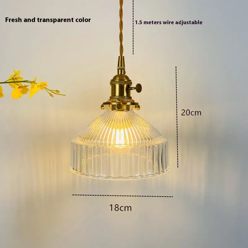 Nordic-style brass and glass chandelier light fixture with an adjustable cord.