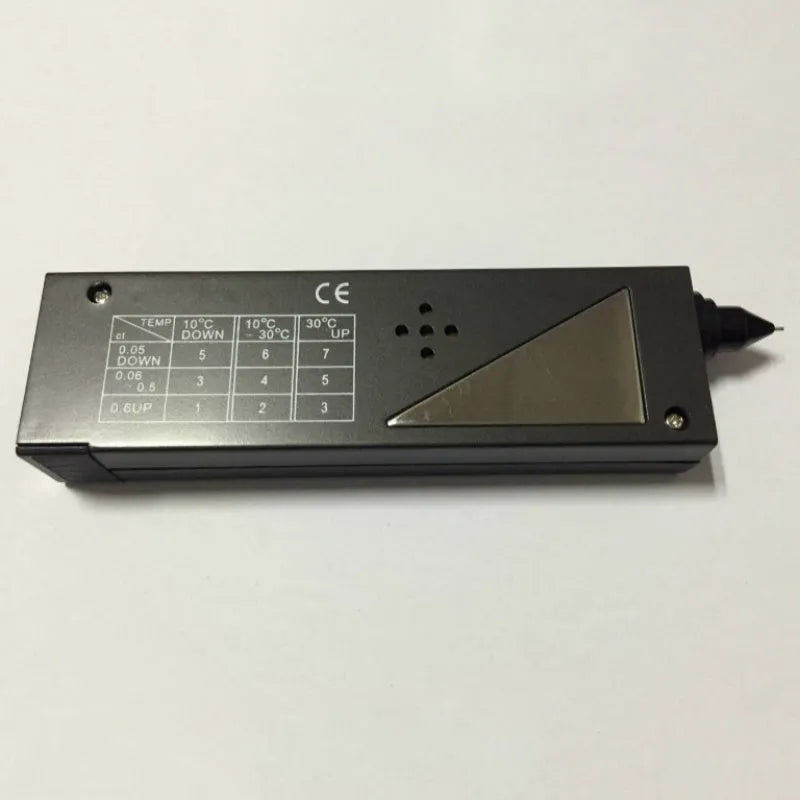 Black handheld diamond thermal conductivity meter with metal probe on a white background.