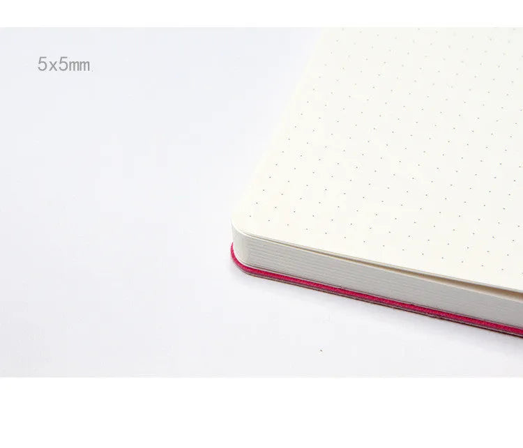Blue A5 dotted notebook with soft imitation leather cover open to show dot grid pages