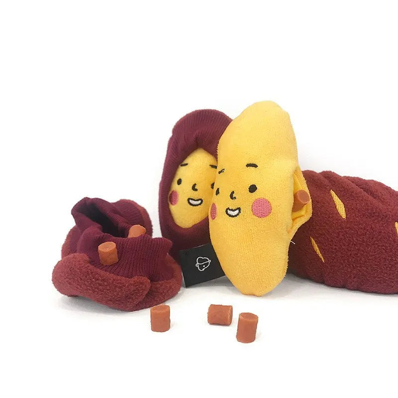 Red sweet potato shaped dog puzzle toy with hidden treat compartments