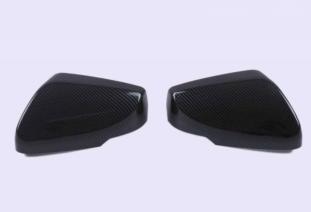 ABS plastic rearview mirror cover for Cadillac CT5 and CT6 models in carbon fibre, silver, or rain frame pattern.