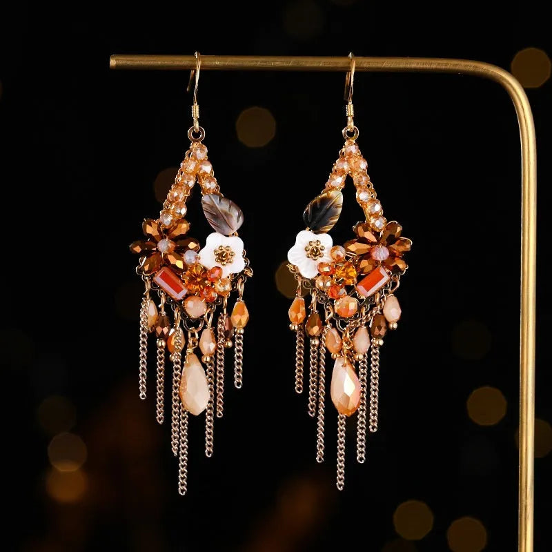 Bohemian style long earrings with hand-woven crystal details and alloy framework