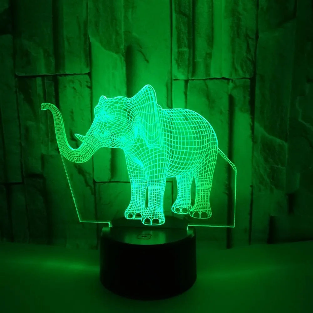 3D elephant-shaped acrylic desk lamp with seven colour modes, USB-powered, on a desk surface