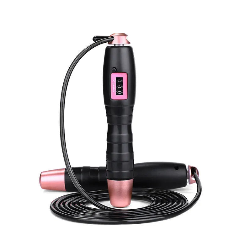 Adjustable digital skipping rope with black ABS handle and TPU coated steel cable on workout mat