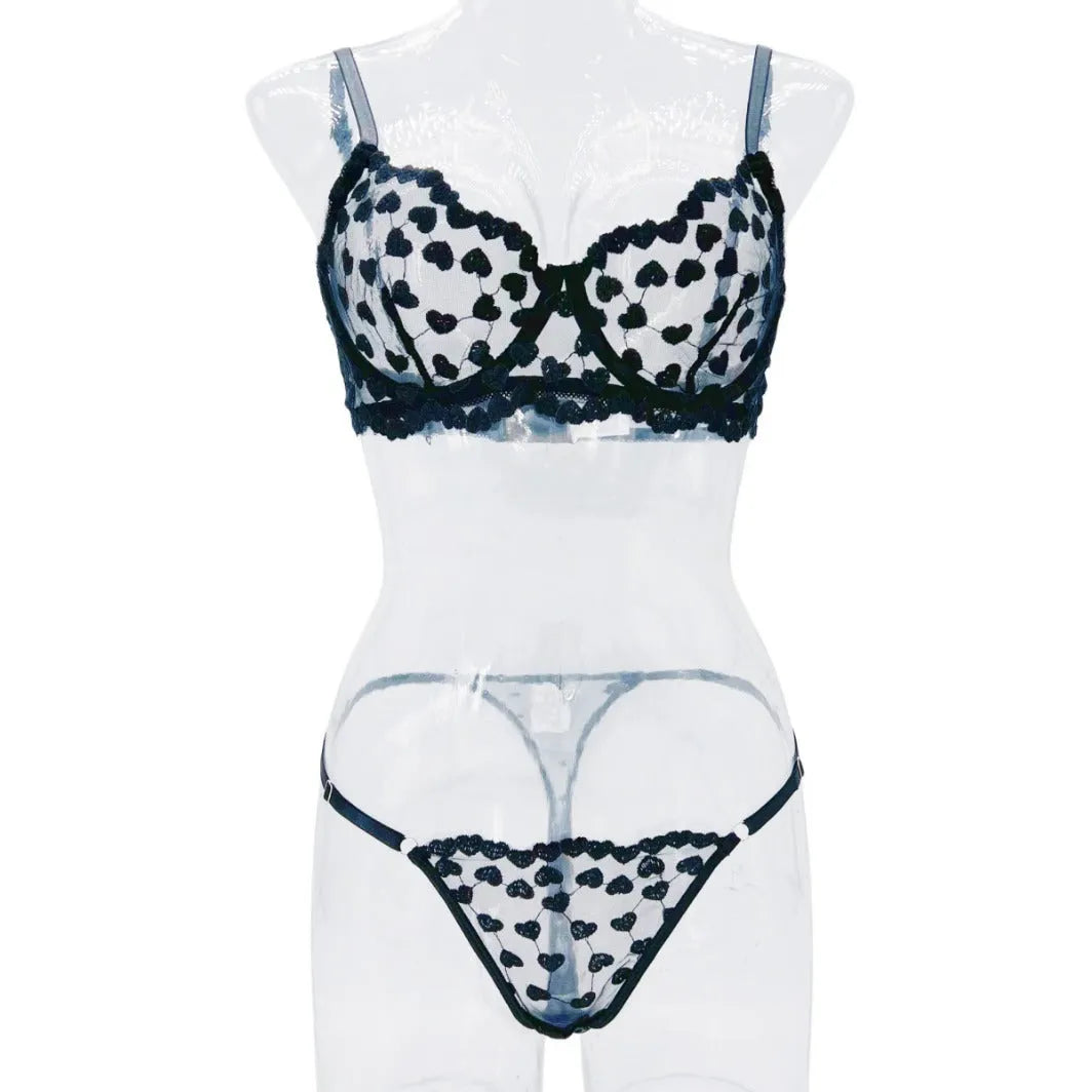 Women's black mesh suit set with lace trim showing crop top and high-waisted shorts combination