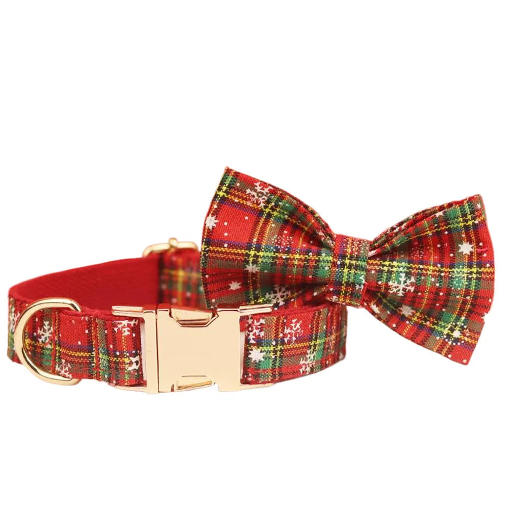 Red snowflake Christmas dog collar and leash set with plaid design and decorative bow on dog vest