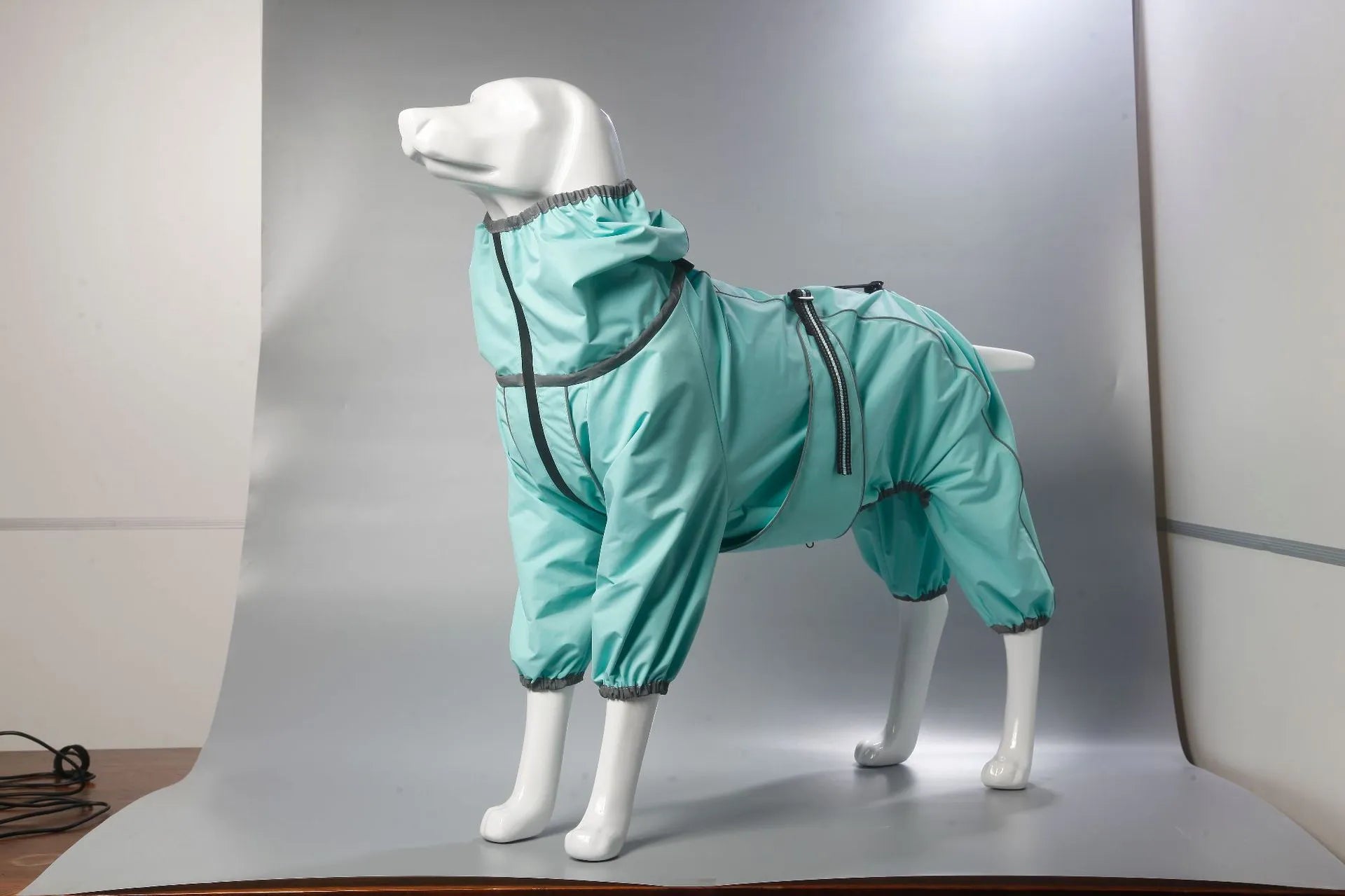 Red polyester padded dog jacket with zip front on a medium-sized dog.