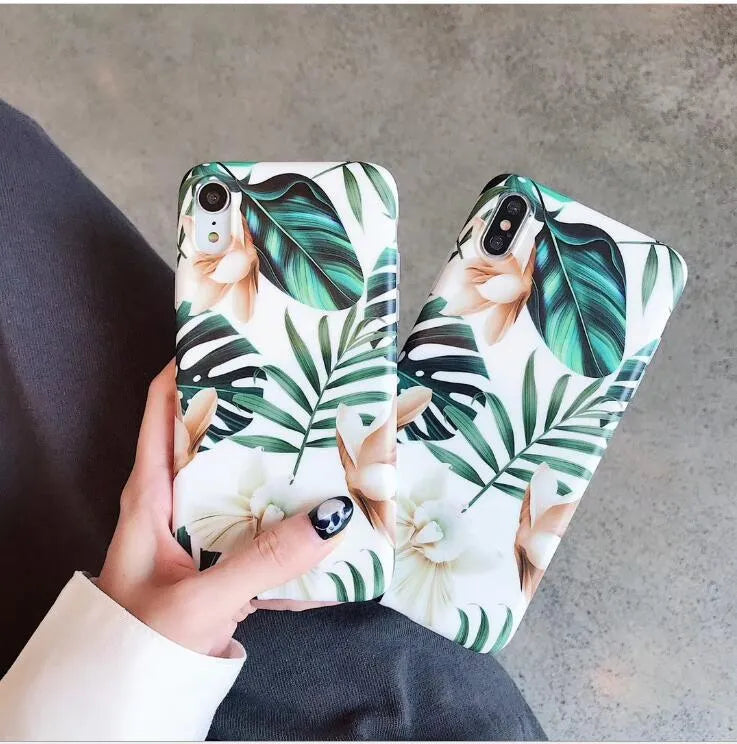 LOVECOM floral iPhone back case with banana leaf design on a smartphone.
