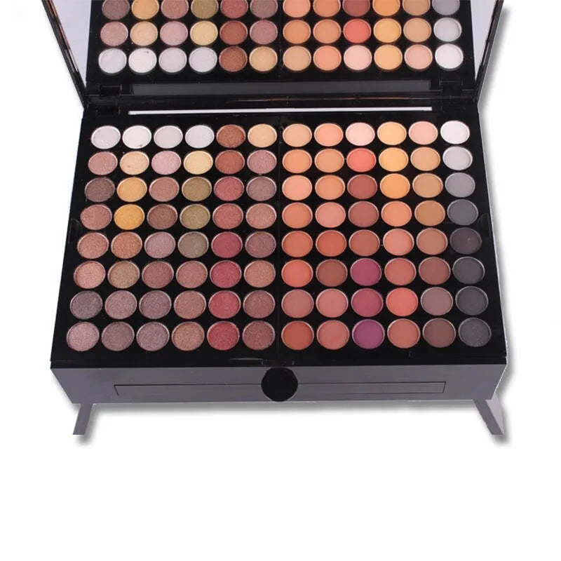 Piano-shaped makeup palette open to show 190 powder pans including eyeshadows, blushes, and face powders