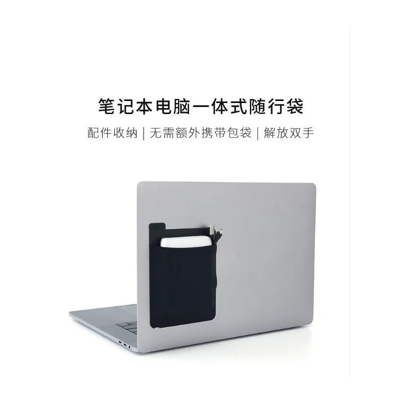 Black adhesive laptop back storage bag attached to a laptop, 15x12 cm, with pen loop and small items inside