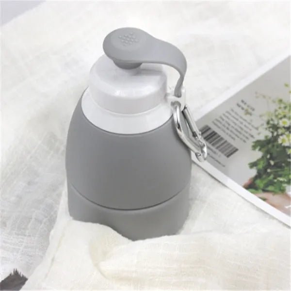 Blue silicone folding water bottle shown at full 22cm height and folded to 11cm height