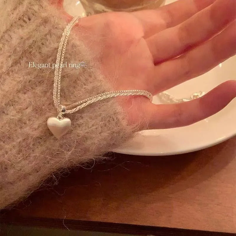 Women's double-layer brushed heart pendant necklace with adjustable silver chain