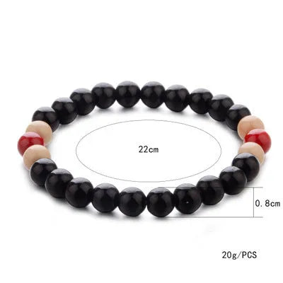 Natural stone essential oil bracelet with lava stone beads on wrist, showing ethnic style unisex design
