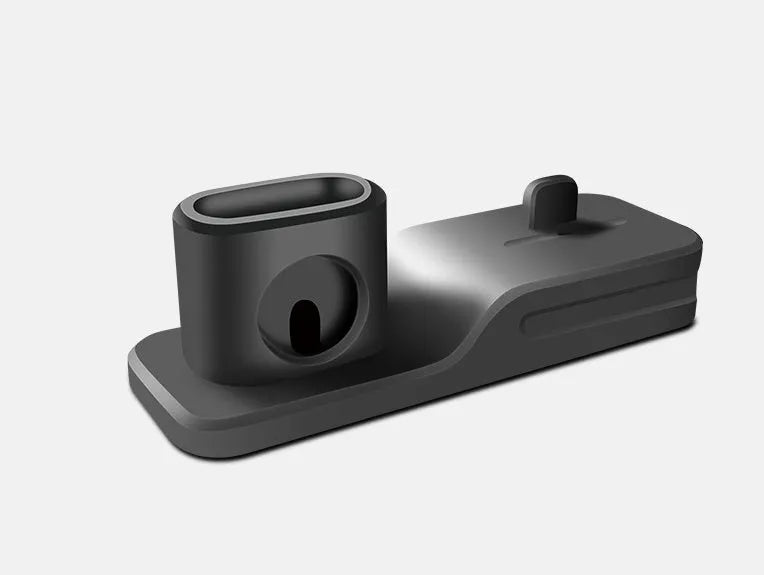 Black silicone 3-in-1 wireless charging station for Apple Watch, AirPods and iPhone on a desk