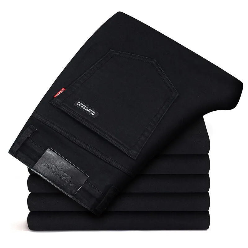 Men's slim straight leg jeans in black cotton denim with mid waist and zip fly, sizes 28-40.