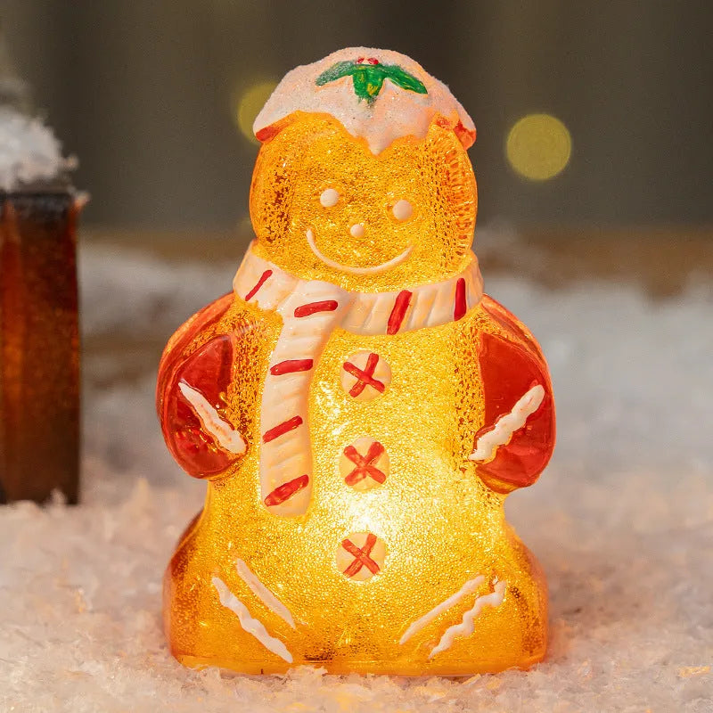 Glowing LED Christmas gingerbread man and snowman ornaments with removable scarves in different colours.