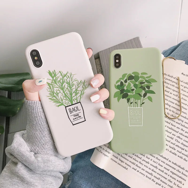 White silicone iPhone case with a detailed painted plant pattern on the back.