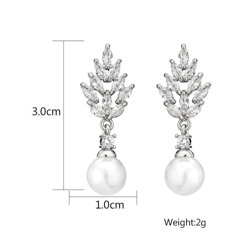 Geometric floral design earrings with micro inlaid zircon detail in gold, platinum, and rose gold finishes.