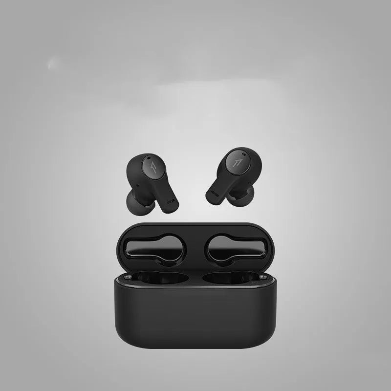 Pearl white and black true wireless Bluetooth sports headphones with USB charging cable.