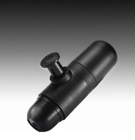 Black portable manual coffee machine measuring 6cm by 17.5cm on a table