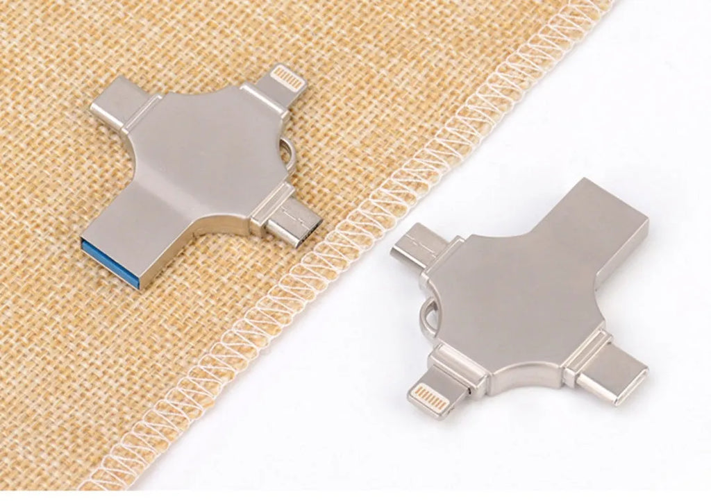 Silver metal 4-in-1 USB 3.0 flash drive with iOS, Micro USB, Type-C, and USB connectors for mobile phone and computer data transfer