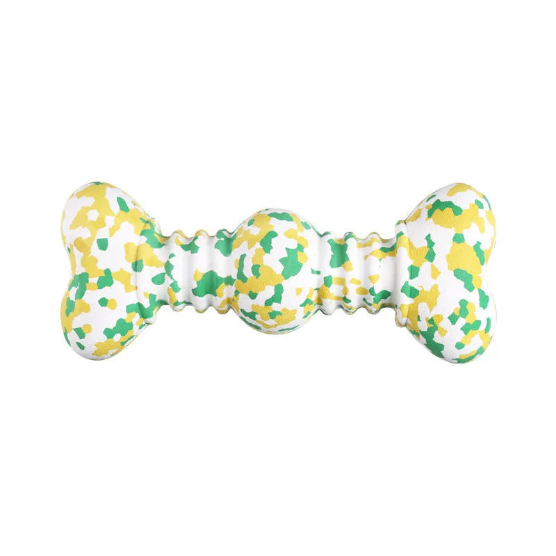 Green and white camouflage patterned natural rubber dog chew toy for large breeds on a wooden floor.