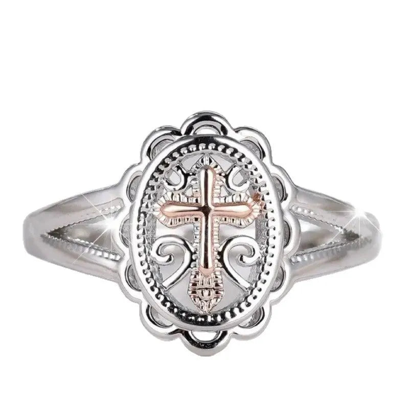Silver-coloured personalised cross lace ring showing intricate patterning and cross design on alloy band