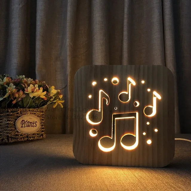 Solid pine wood cube USB atmosphere lamp glowing with warm white LED light on a wooden surface.