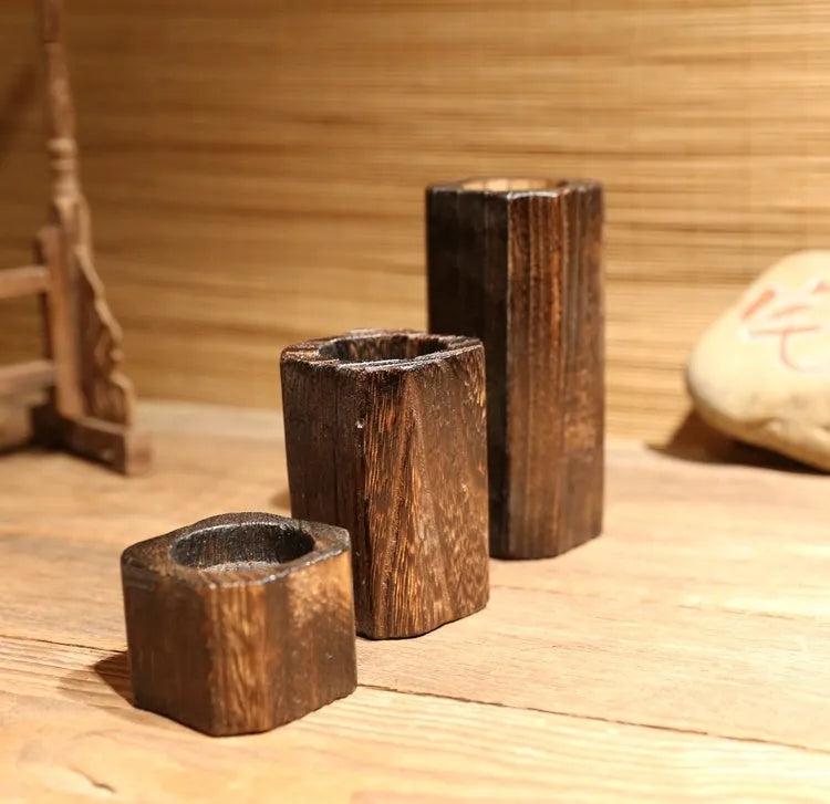 Set of three solid wood candle holders in natural paulownia with charcoal finish, small 5cm, medium 10cm, large 15cm, square top 6x6cm