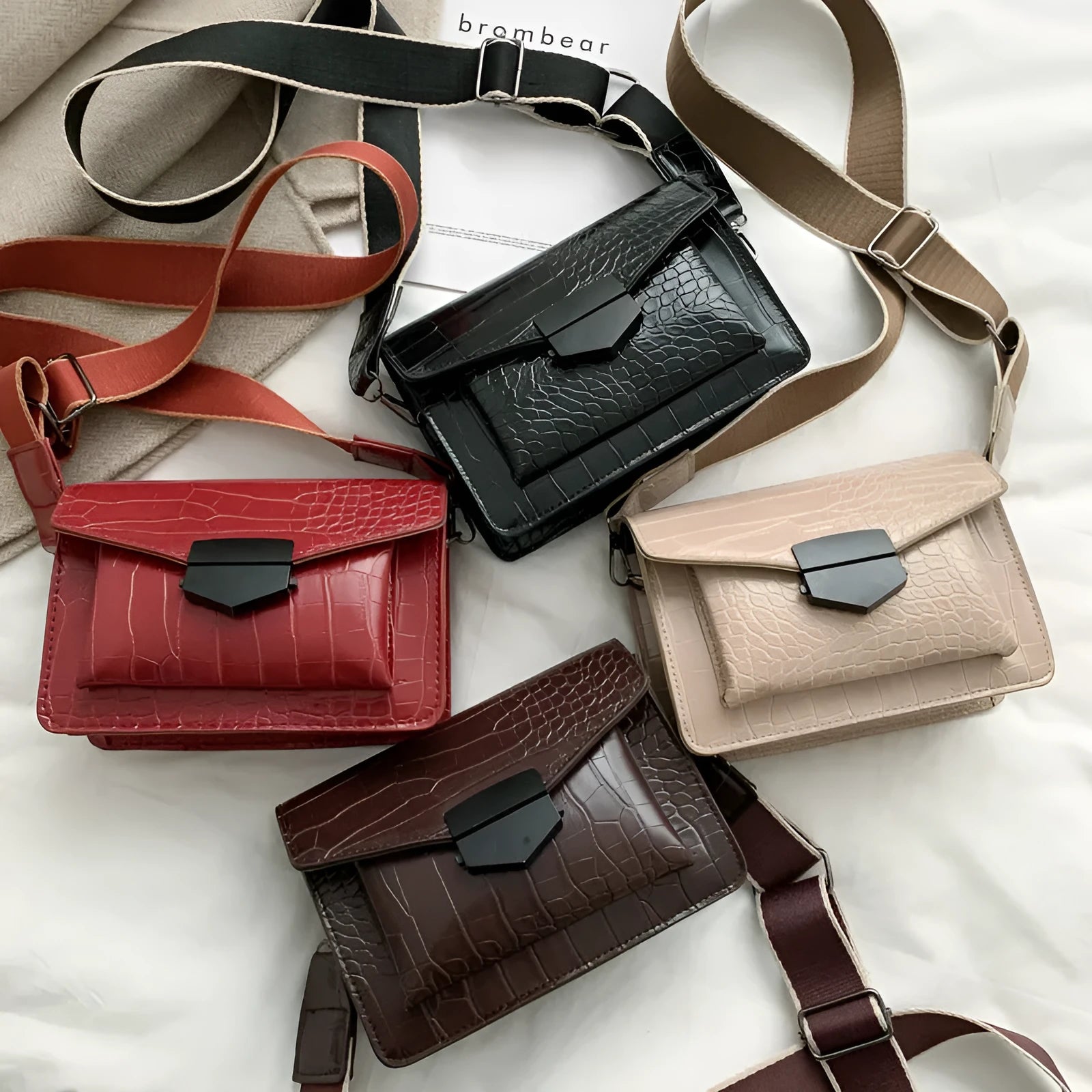 A PU fabric crossbody bag with an adjustable strap, shown in dark brown colour.