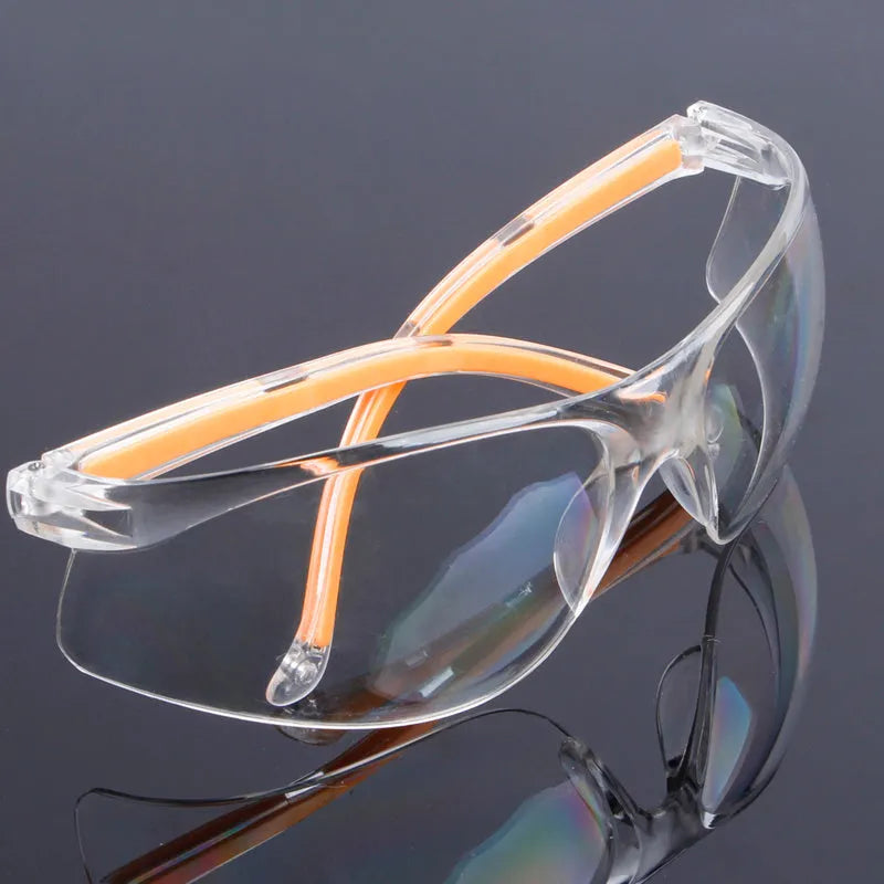 Transparent polycarbonate safety goggles with yellow tinted lenses for eye protection.