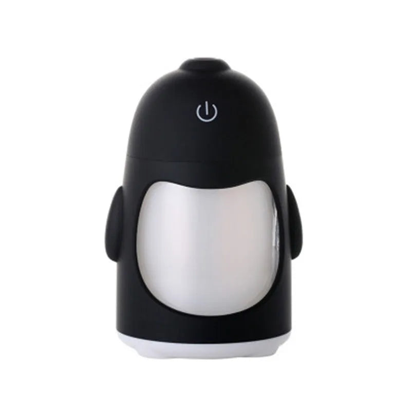 Penguin humidifier with soft blue nightlight glow, 150ml cool mist diffuser, USB powered, available in pink