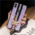Pearl-coloured acrylic iPhone case with diamond patterns, butterfly design, and a central mirror panel.