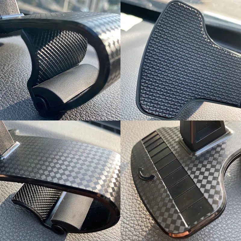 Black 360-degree adjustable universal car phone holder on a dashboard