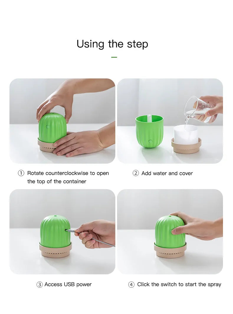 Cactus humidifier night light in green with colourful LED glow on a wooden desk