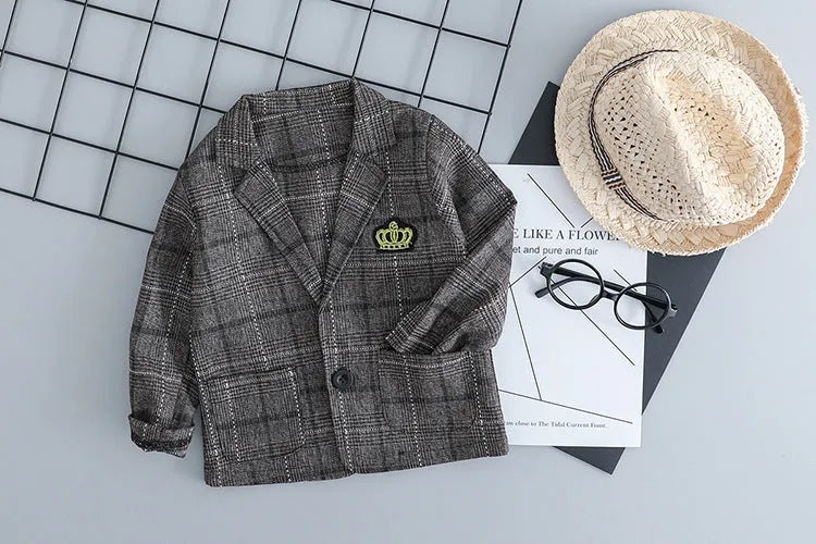 Infant boy's grey three-piece suit with long sleeves on a hanger.