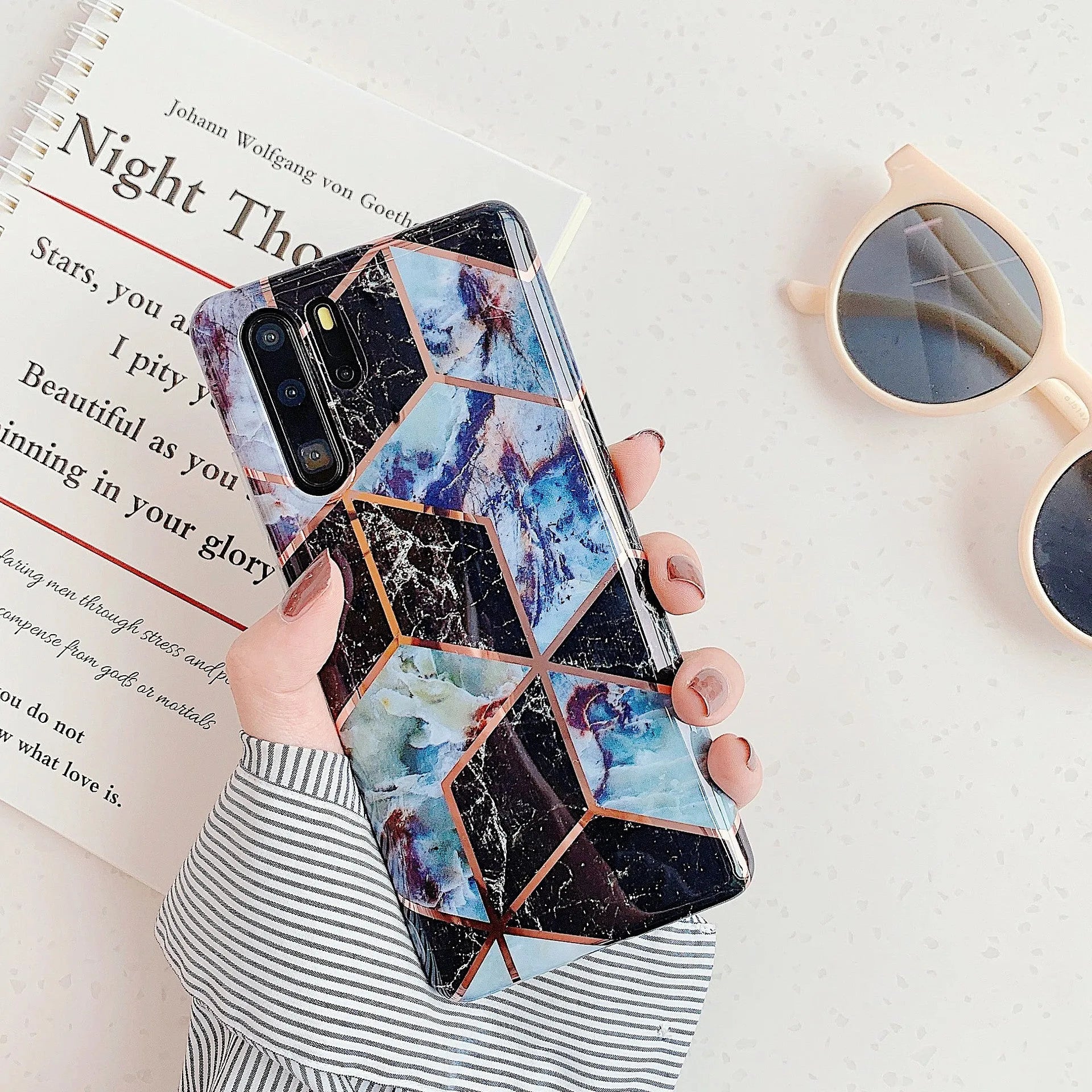 Electroplated marble design phone case for Huawei and Samsung smartphones in various colours.