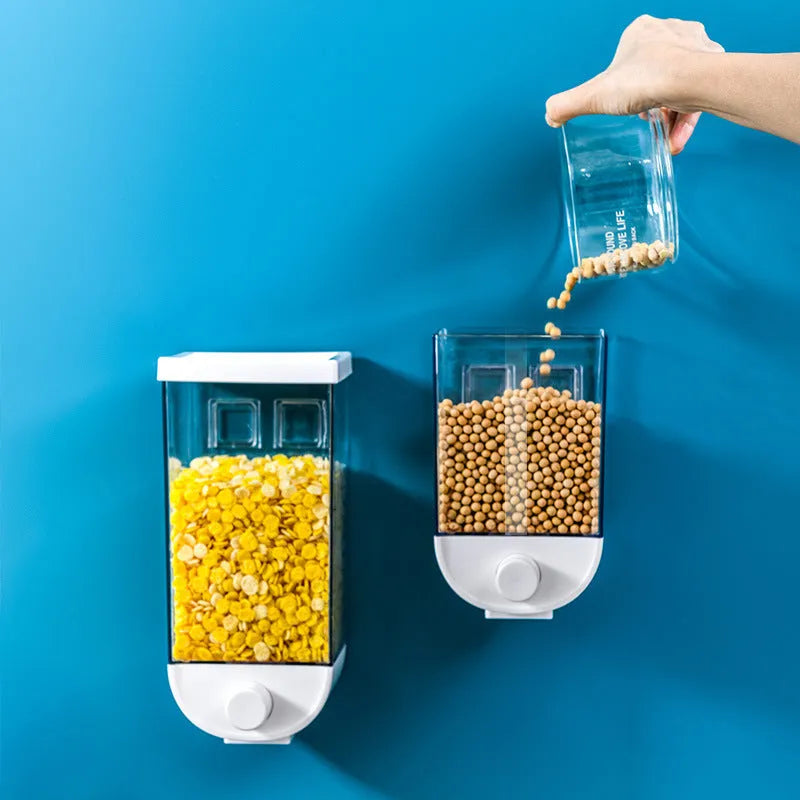 White wall-mounted transparent kitchen food storage container with easy-press cereal dispenser lid.