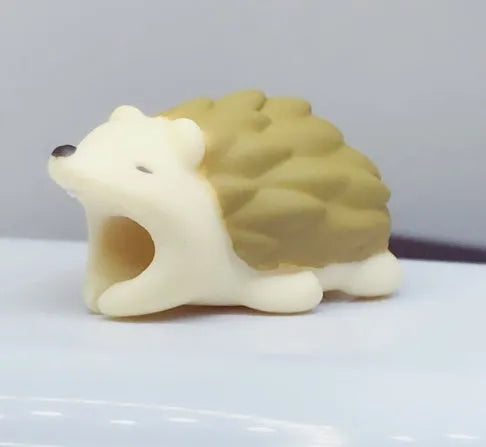 iPhone Lightning cable protector in an animal design, shown on the end of a charging cable.