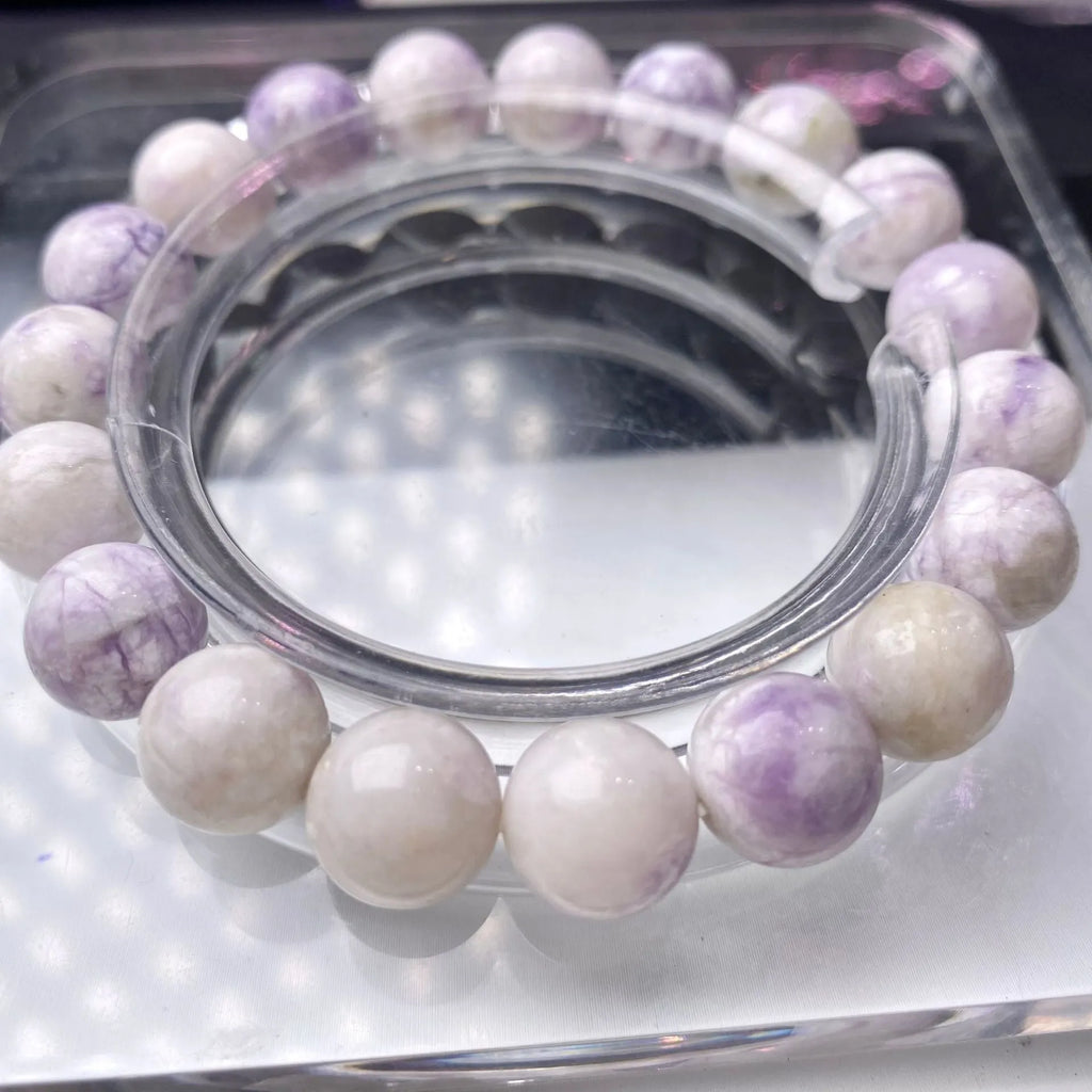 A natural purple turquoise bead bracelet for women, shown in a choice of 6mm, 8mm, or 10mm bead sizes.