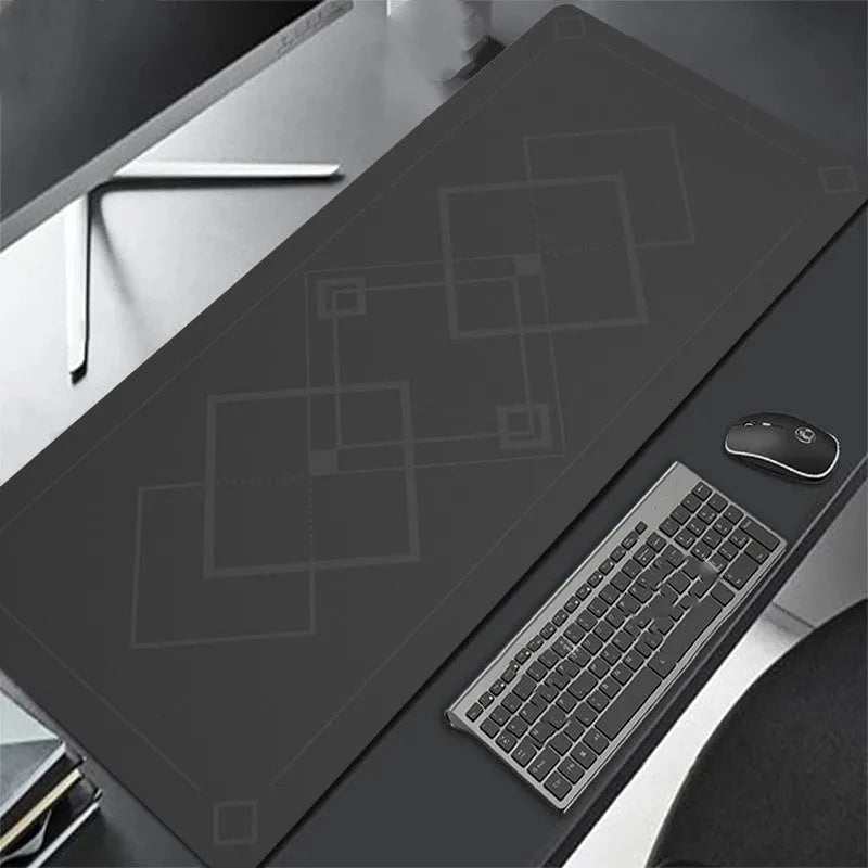 All black extra long mouse pad with precision overlock stitching on a desk